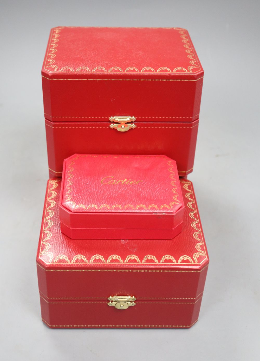 Four assorted Cartier jewellery boxes.